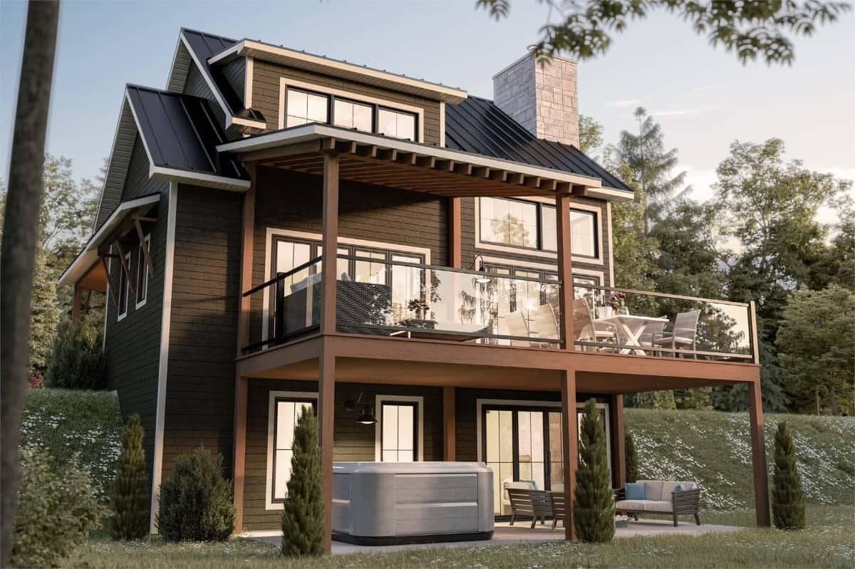 Rear view with stacked porches topped with a large shed dormer.