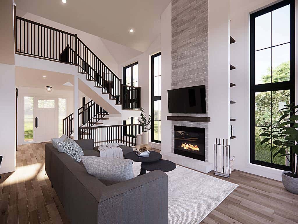 Tall windows fill the living room with abundant natural light.