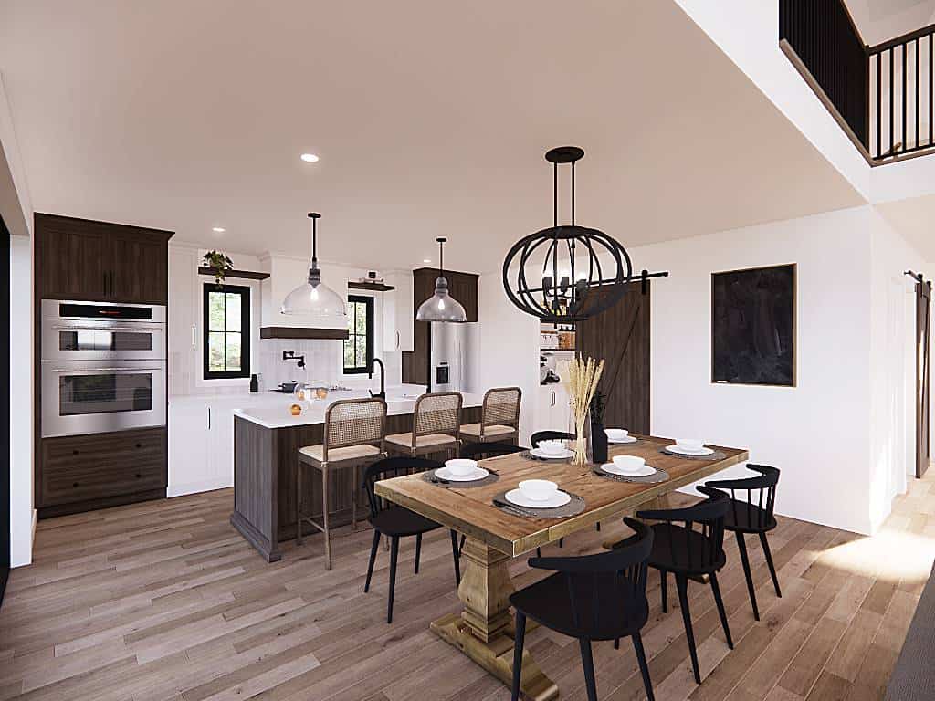 Kitchen and dining room with white and wood palette that give a warm and inviting ambiance.