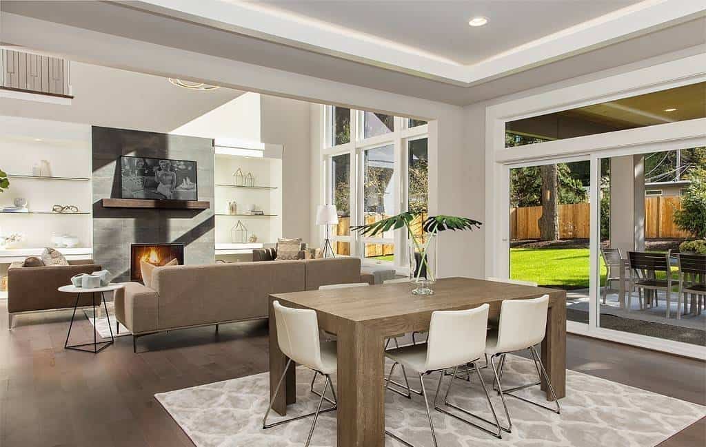 Family room and dining area with sliding glass doors that open onto a covered porch.