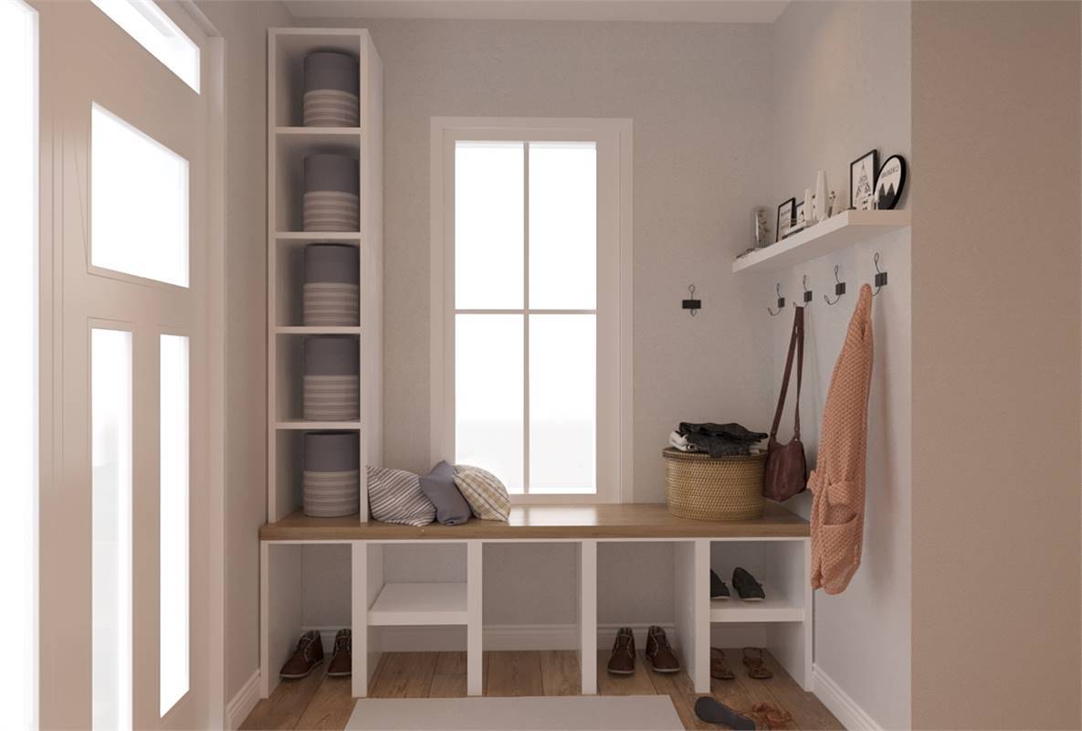 Foyer with built-in bench, cubbies, and hooks.