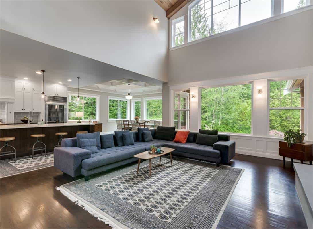 A wall of windows fill the great room with natural light.