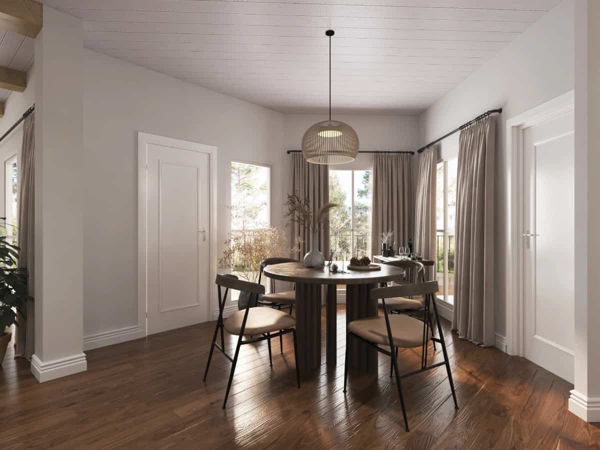 Casual dining with a round dining set and corner windows overlooking the rear deck.