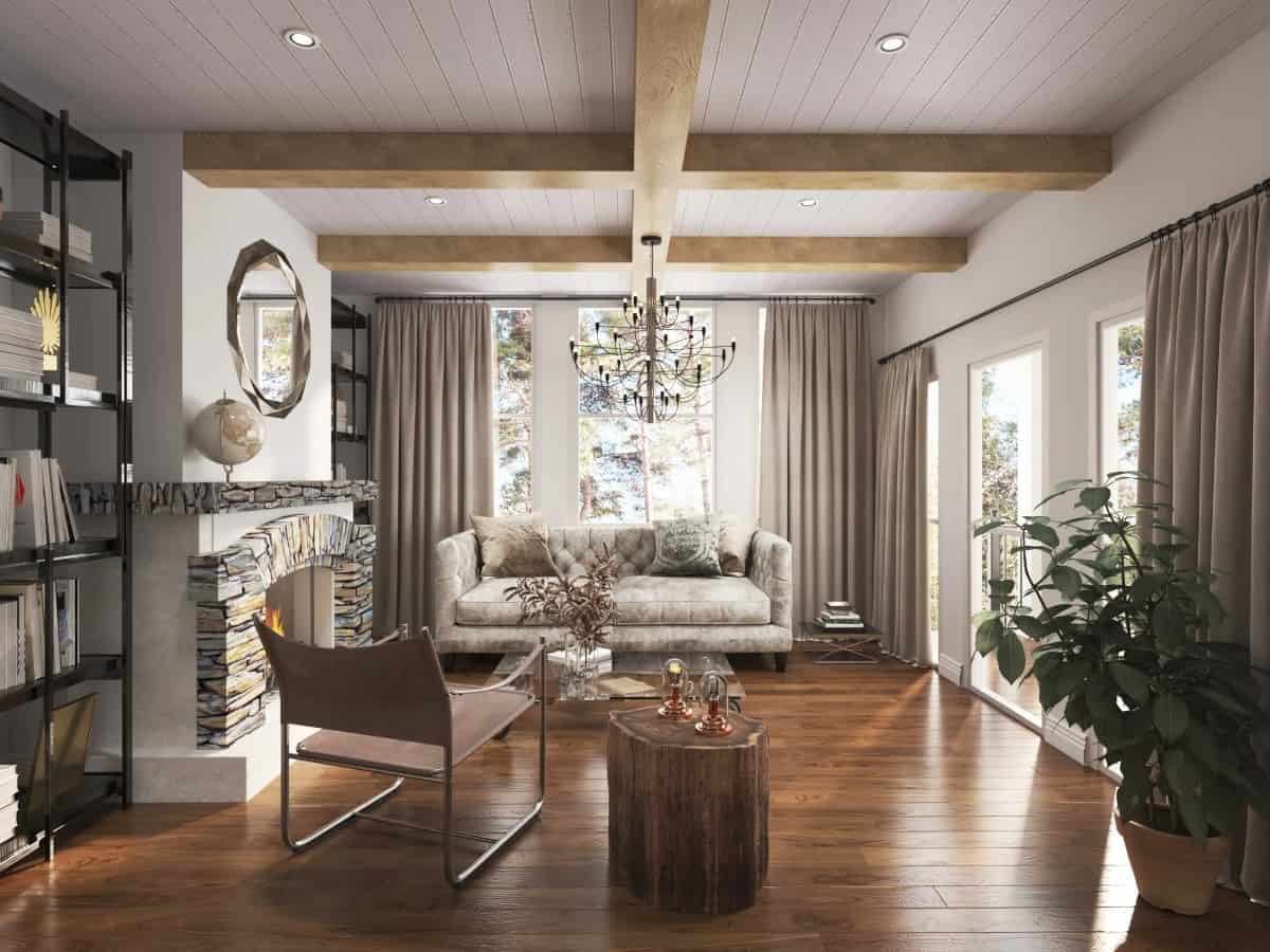 Keeping room with a leather sofa, a metal armchair, and a fireplace flanked by shelving units.