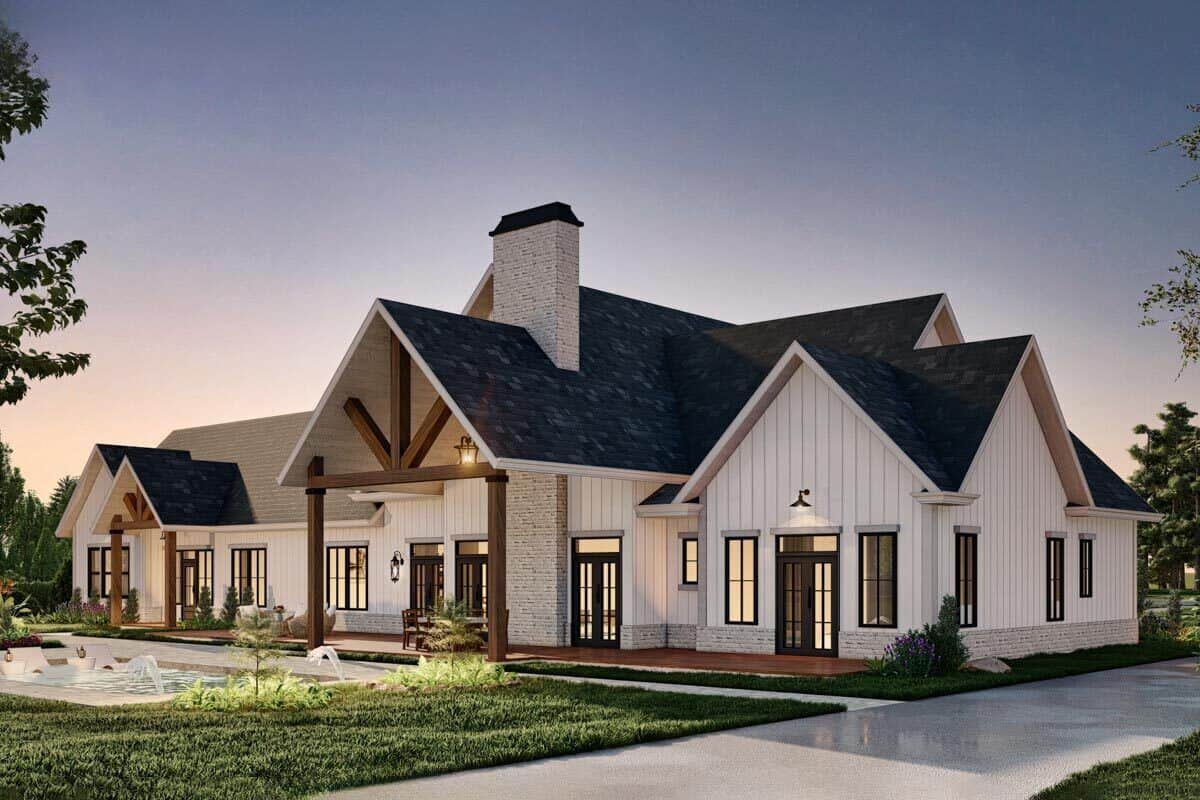 Rear-left rendering with multiple gables and an expansive patio with a brick chimney.
