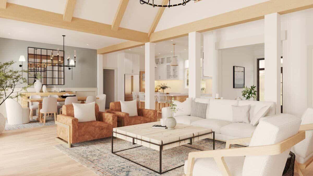 An open layout view of the vaulted great room, dining room, and kitchen.