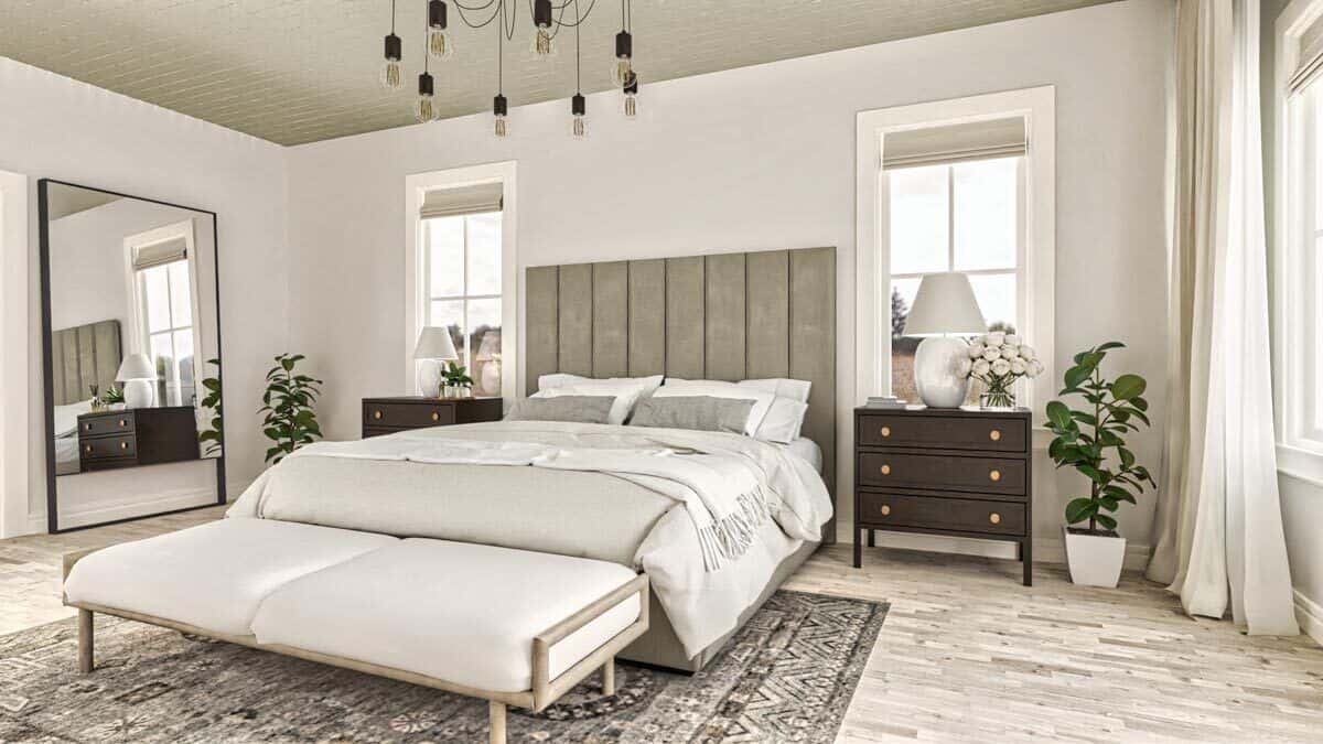 The primary bedroom includes a full-length mirror and a patterned rug over the hardwood flooring.