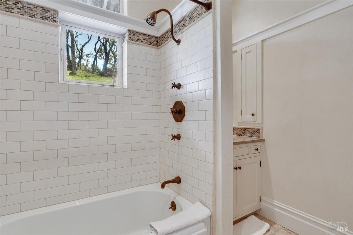 Bathroom with a soaking tub and shower.