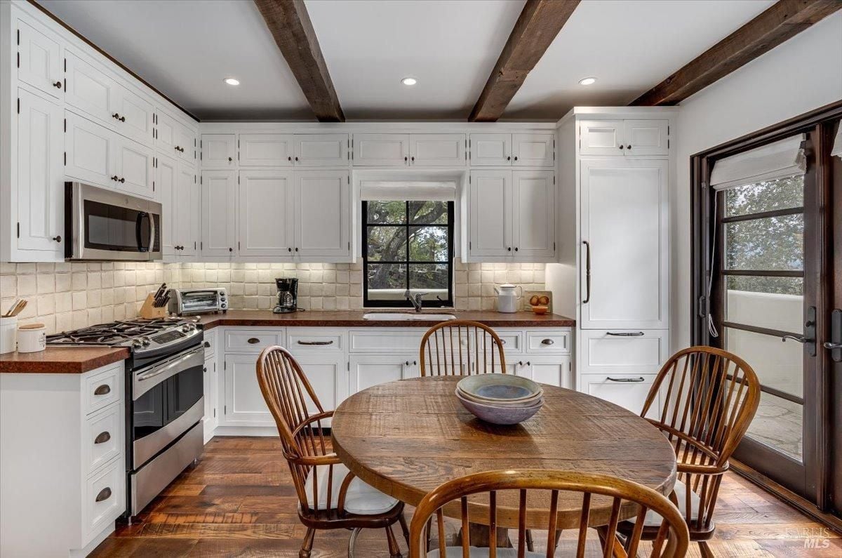 Kitchen with custom lights and custom cabinets.