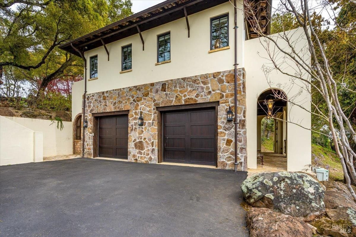 Garage with spacious driveway.