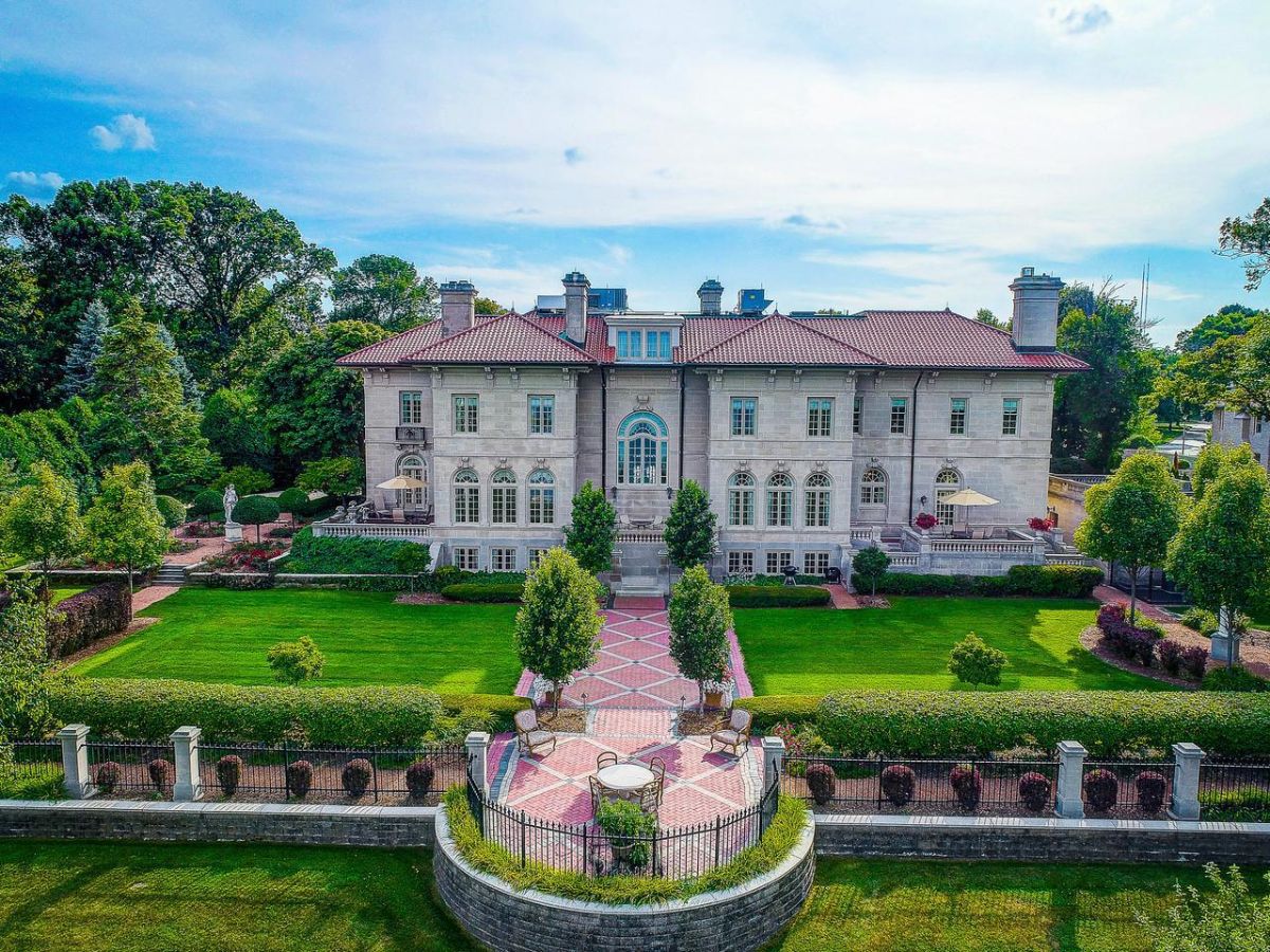 Rear view of the mansion with a huge backyard.