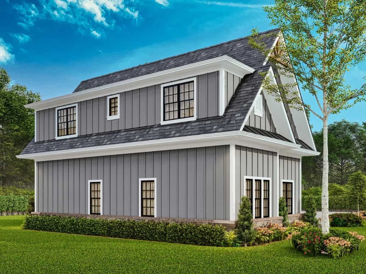 Rear view with board and batten siding and aluminum-framed windows.