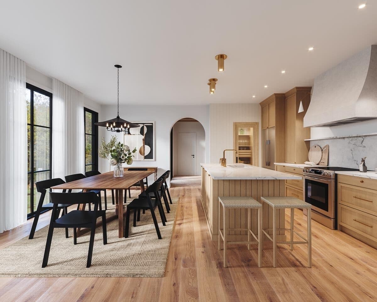 Dining area and kitchen with tall windows and a hardwood floor that match with the cabinets and island.