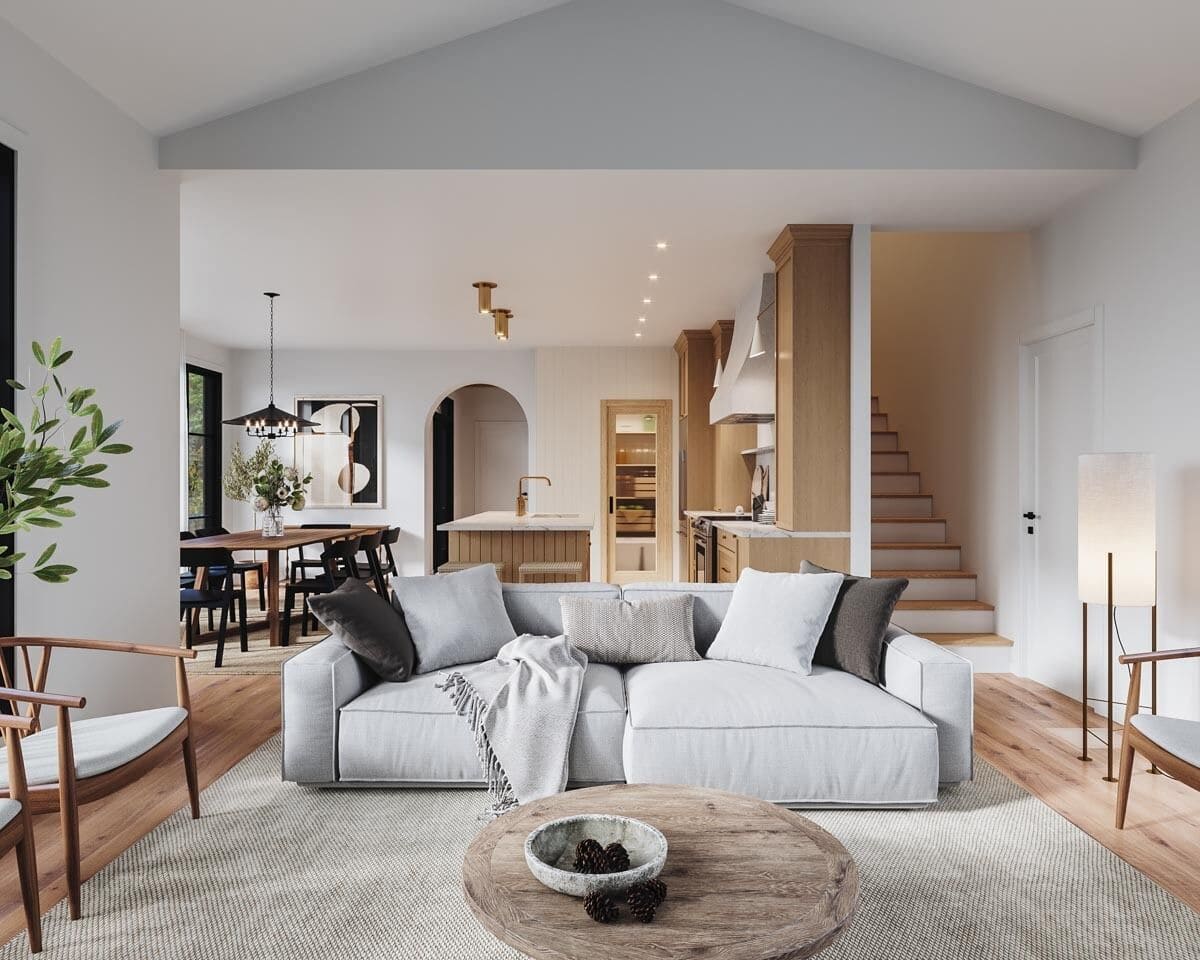 A gray area rug defines the living room in an open layout.