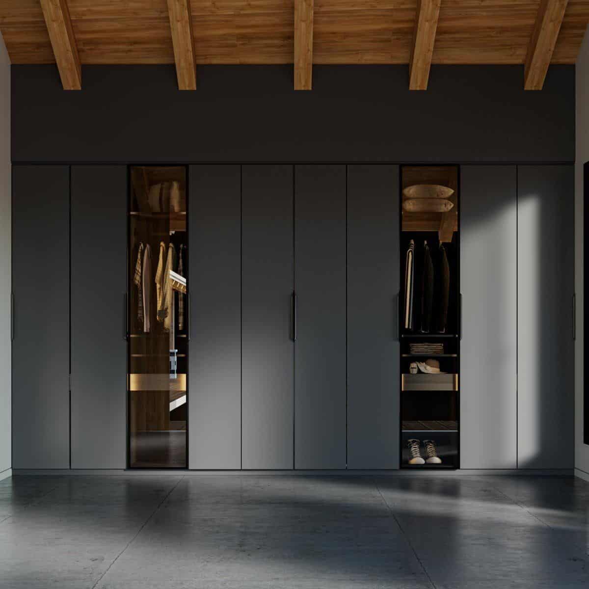 Primary walk-in closet with floor-to-ceiling cabinets encased in black and glazed doors.