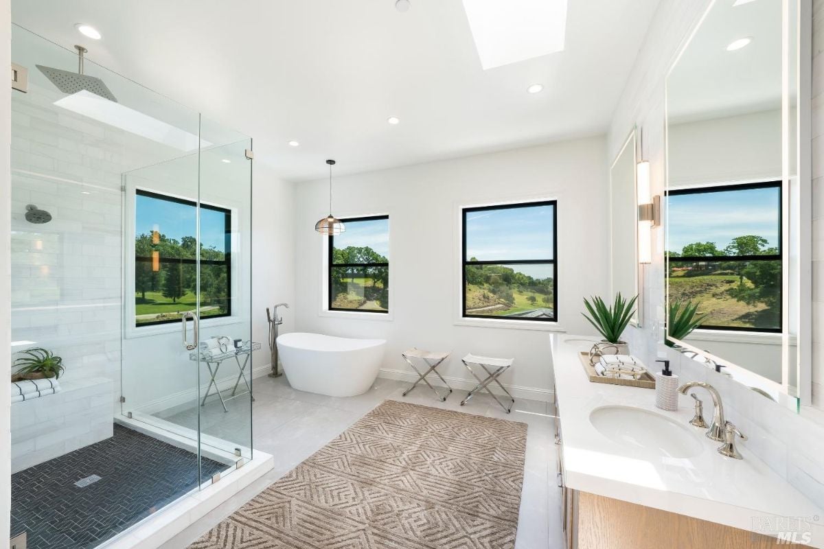 Master suite's bathroom features the tub, shower area and the bathroom's sink.