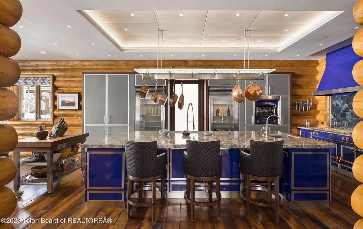 Kitchen with wooden floors and custom lighting.
