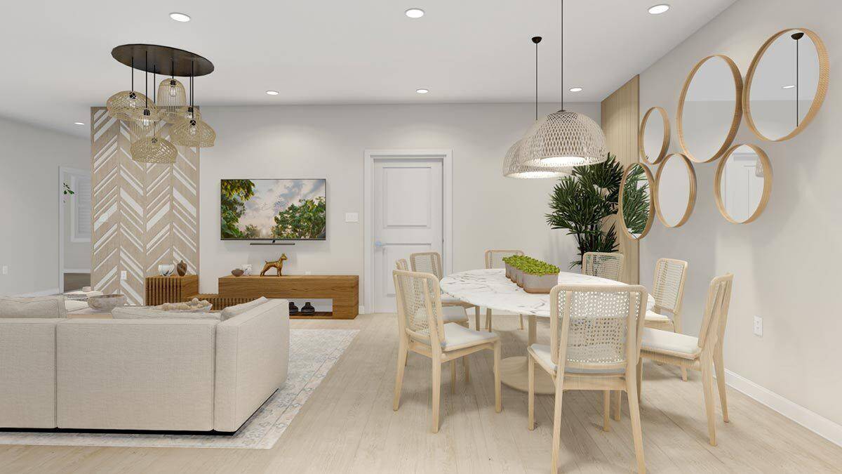 Family room and dining area with light hardwood floor and white walls adorned with mirrors and chevron panels.