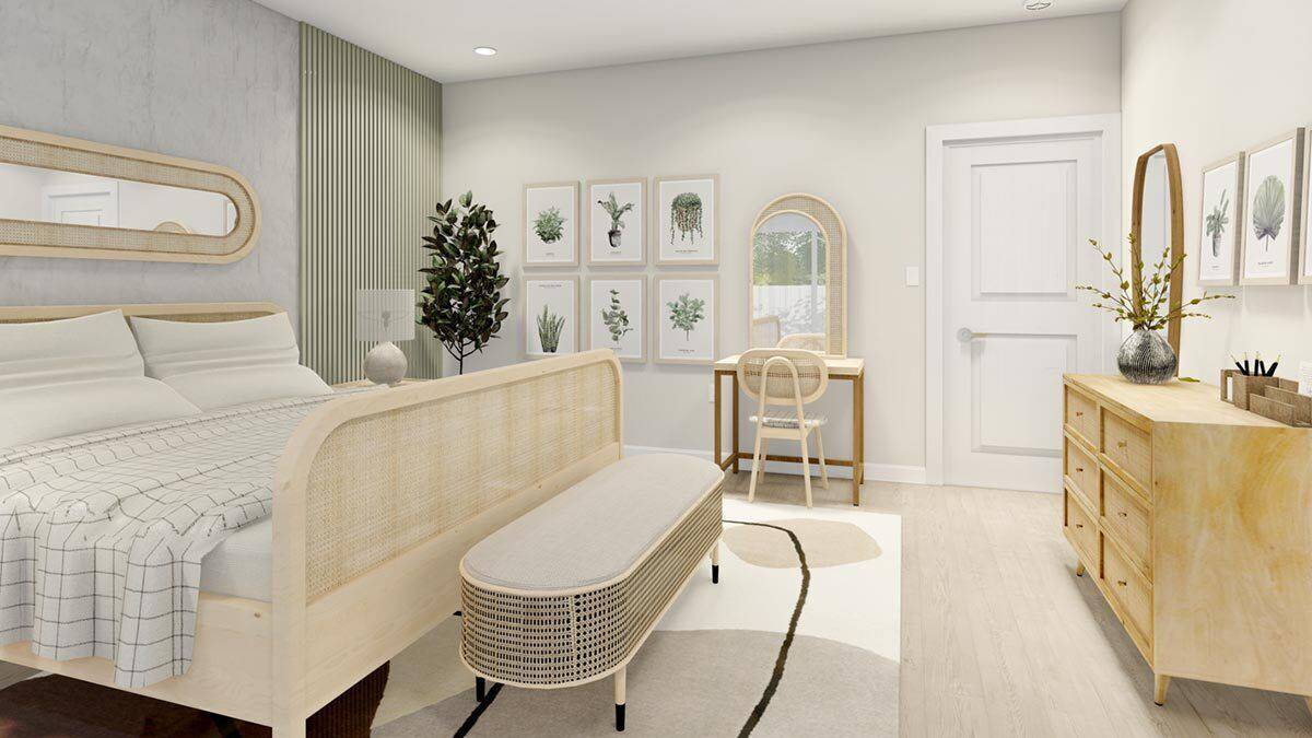 The primary bedroom includes a wooden dresser and a table topped with an arched mirror.