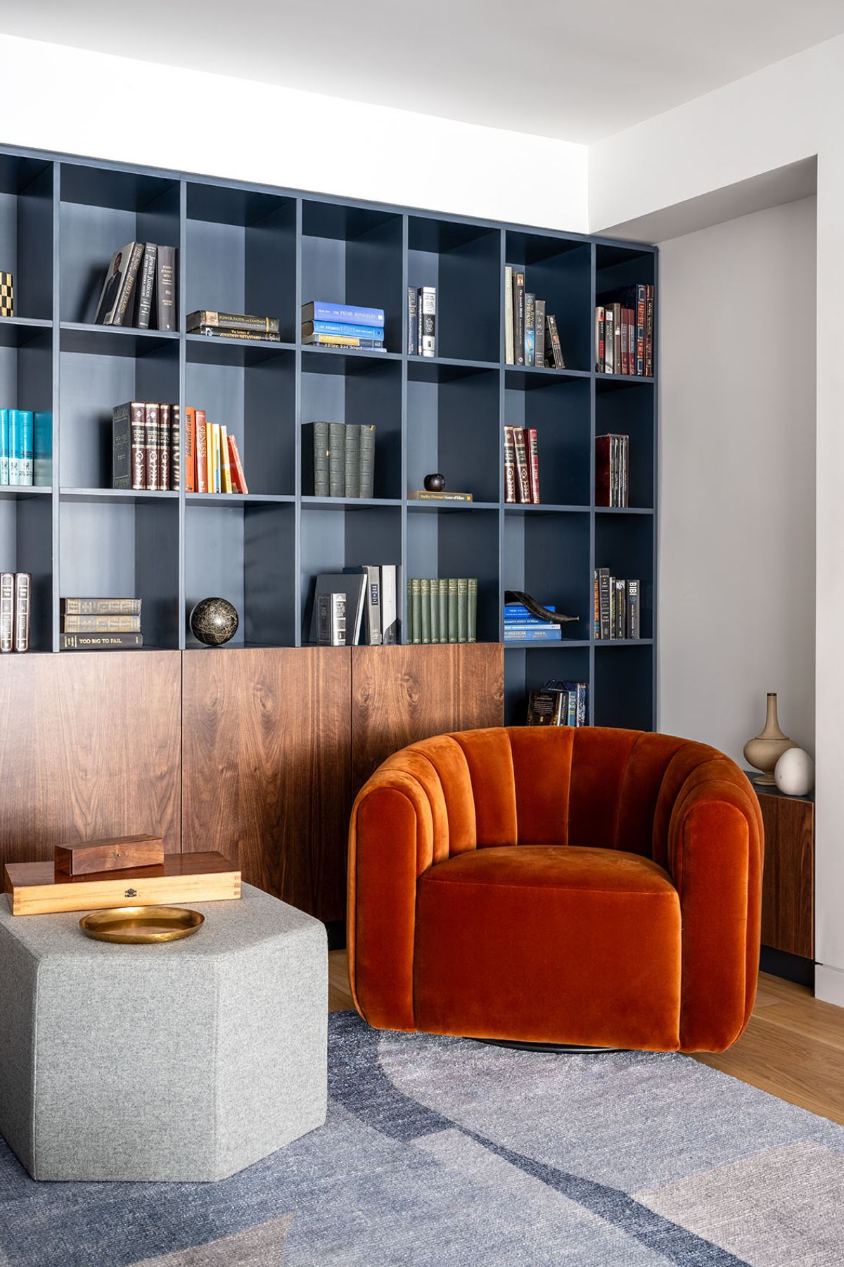 A living room with couch and book shelf