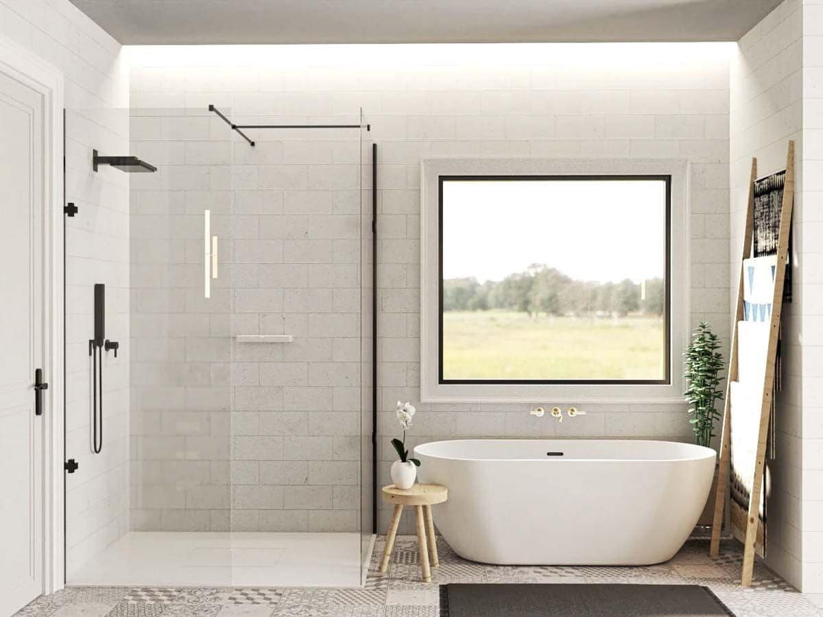 Primary bathroom with a walk-in shower and a soaking tub under the picture window.