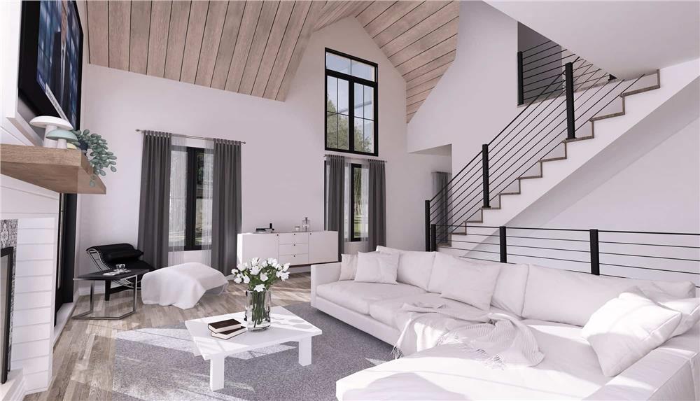 Living room with an L-shaped sofa, a white coffee table, and a TV mounted above the fireplace.