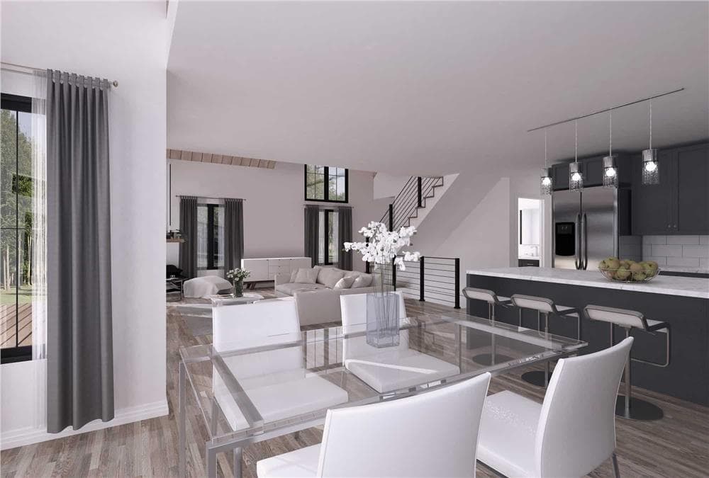 Dining area with a glass-top table paired with white upholstered chairs.