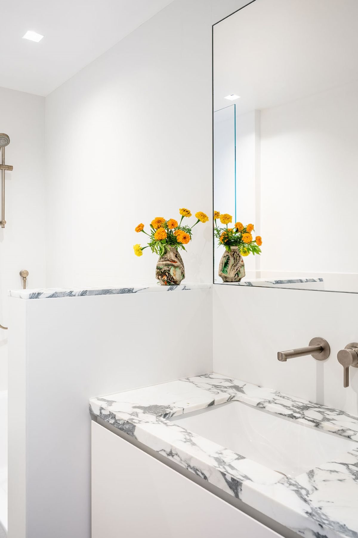 A bathroom with a marble counter top