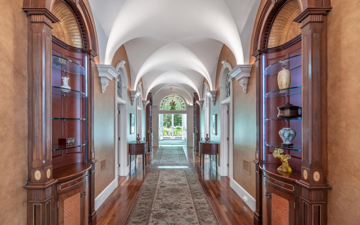 Hallway with a large rug.