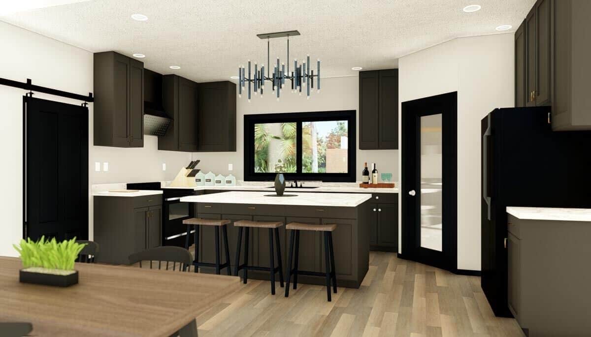 Kitchen with dark wood cabinets, black appliances, and a center island.