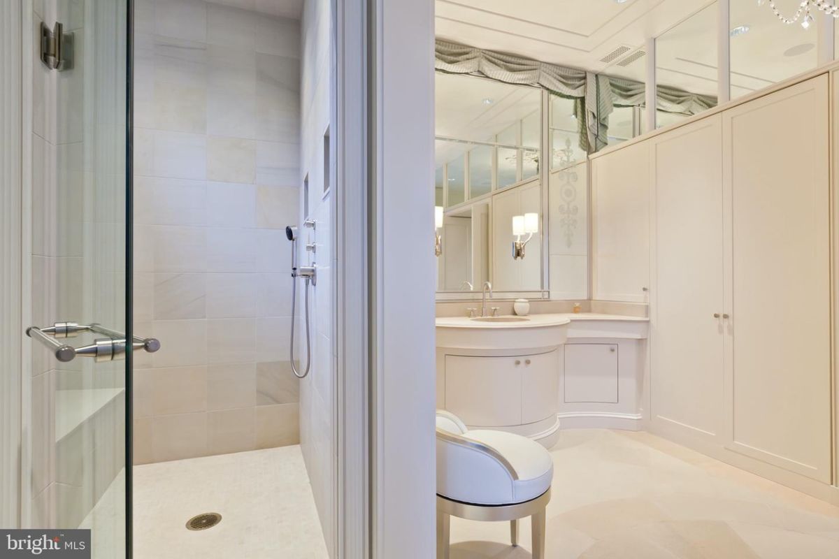 Bathroom with a soaking tub, walk-in shower and a sink.