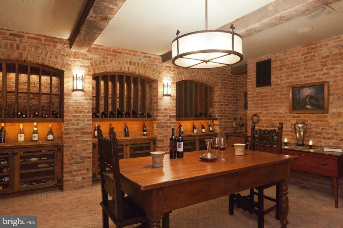 Wine cellar with a wooden table and chairs.