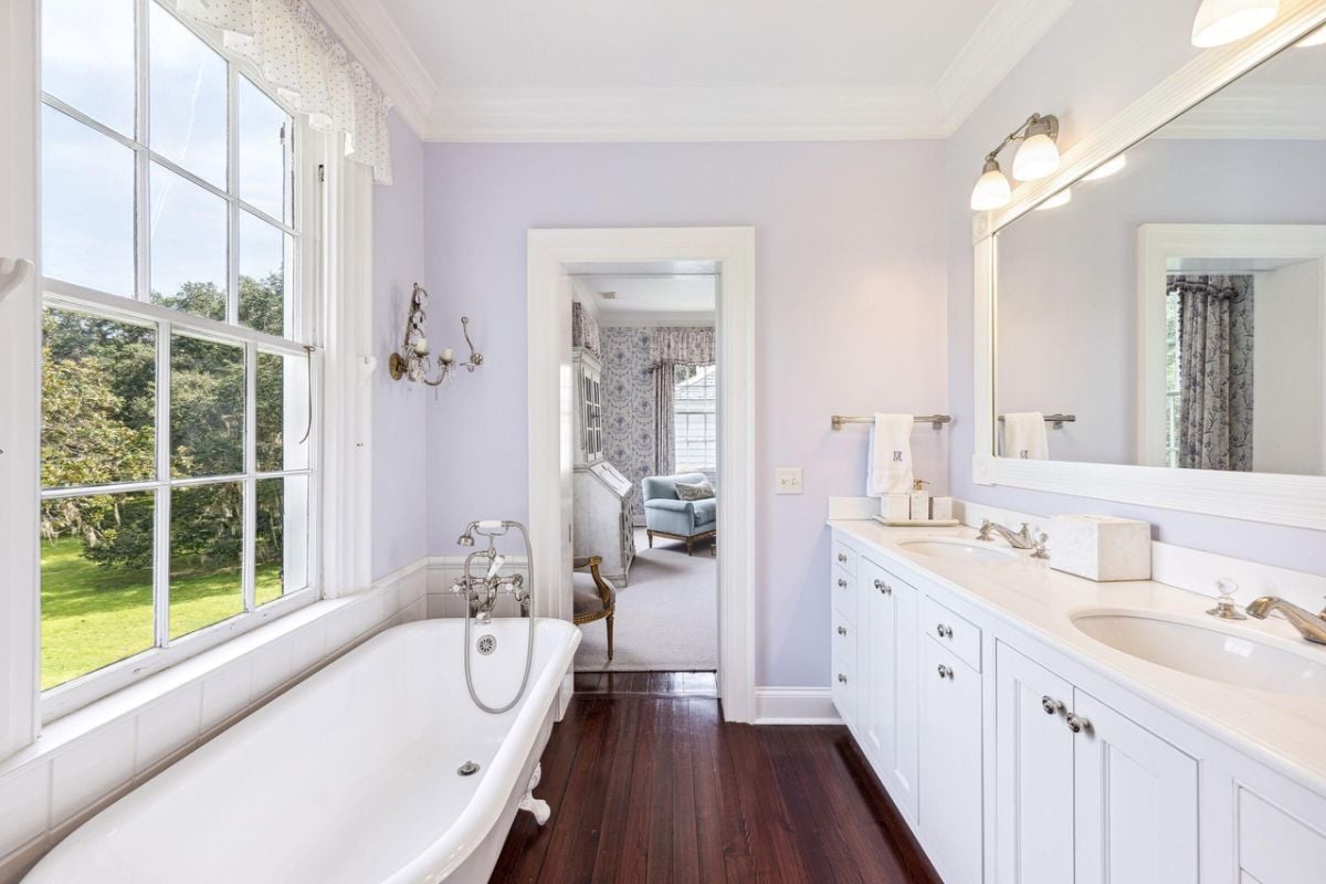 Bathroom with dual sinks and a soaking tub.