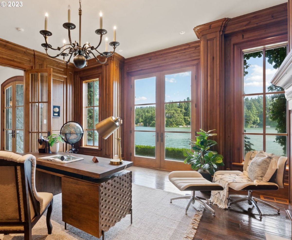 Home office with the desk, chandelier and chairs.
