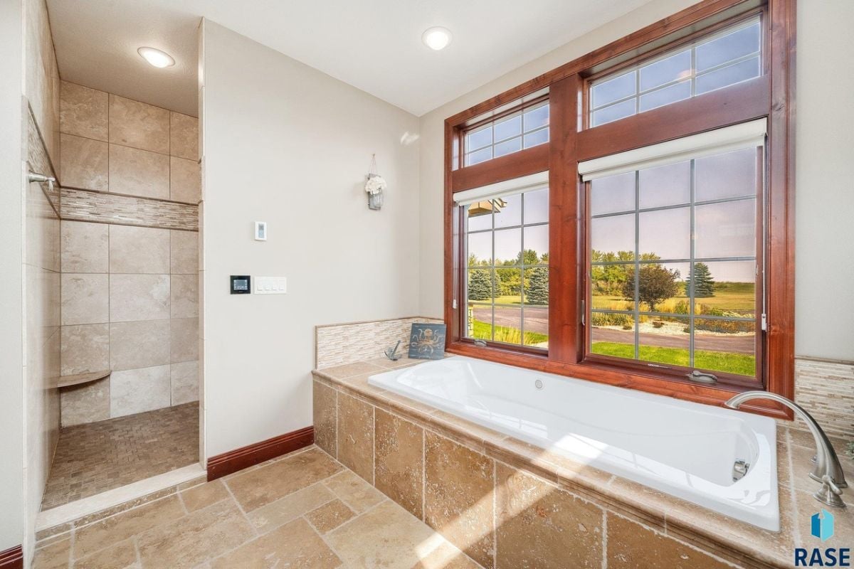 Bathroom with a soaking tub and a shower.