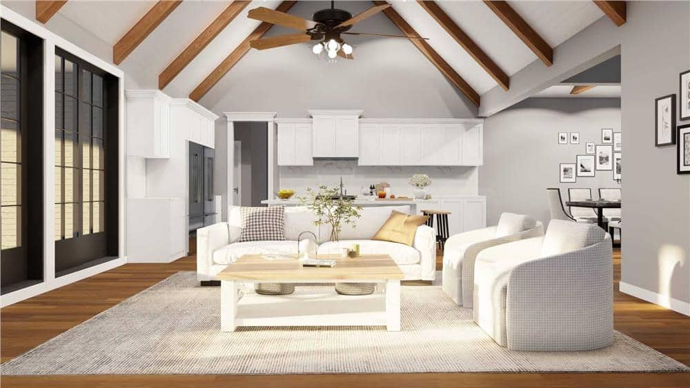 A cathedral ceiling lined with exposed beams crowns the great room.