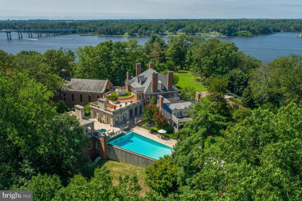 Aerial view of the mansion with a river in the background