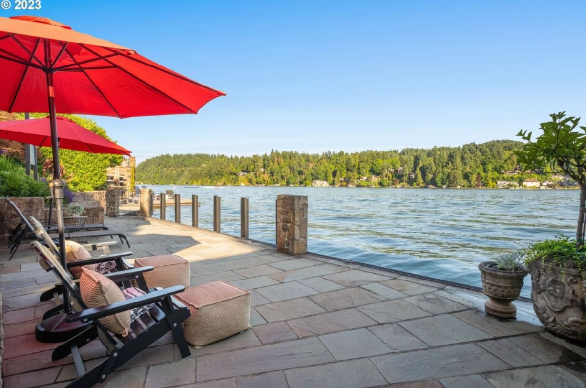 Patio with lounge chairs overlooking the lake.