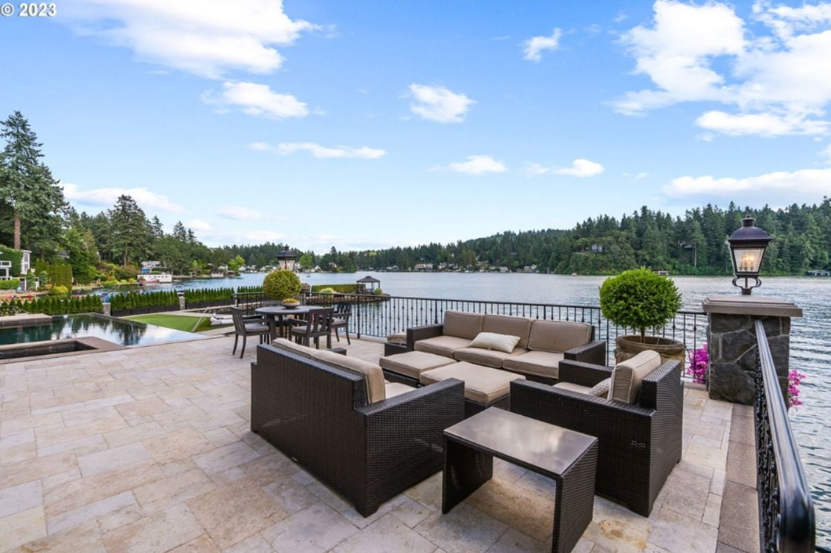 Patio with couches overlooking the lake.