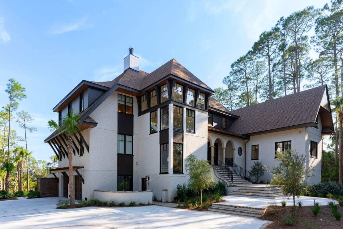 Front view of the mansion with spacious driveway.
