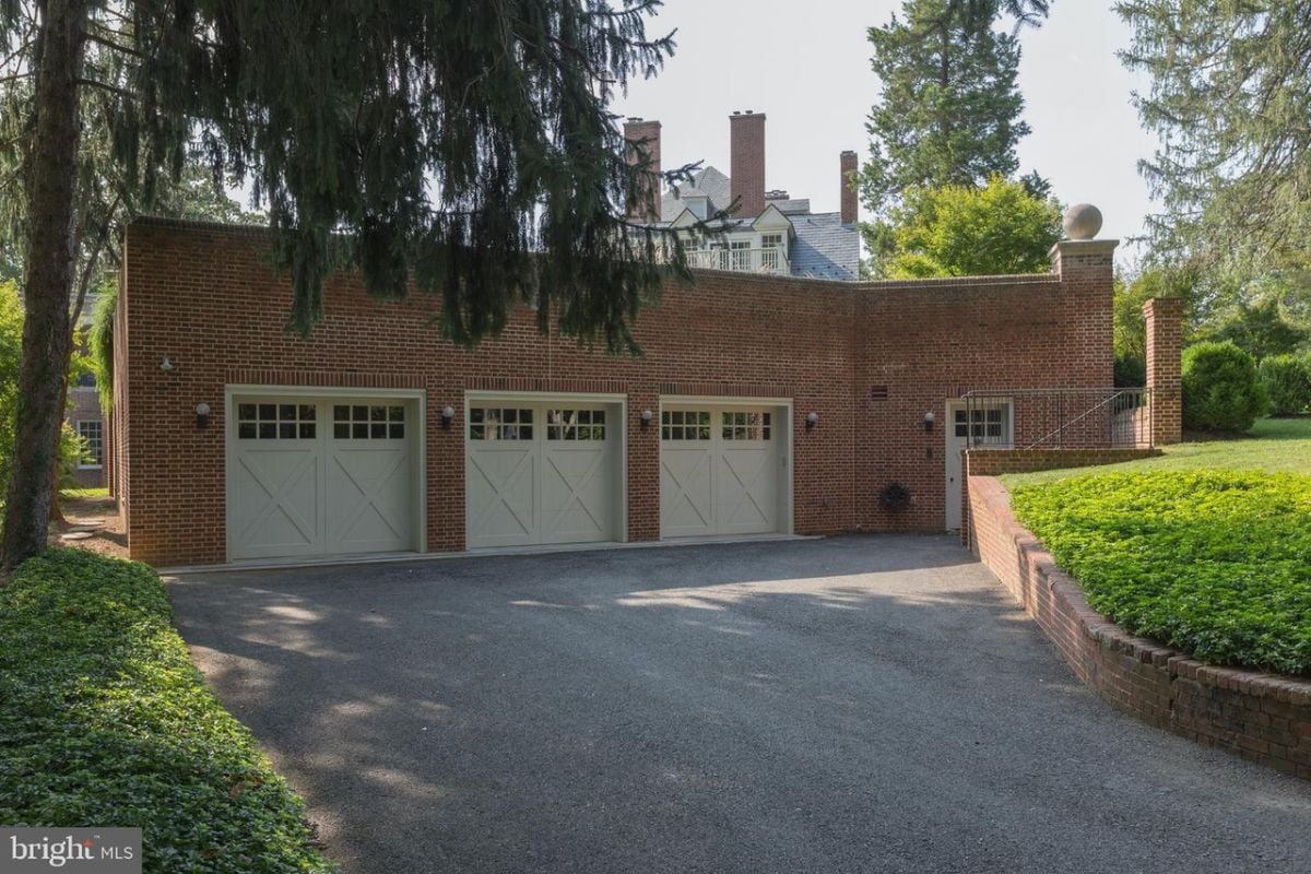 Garage with a spacious driveway.