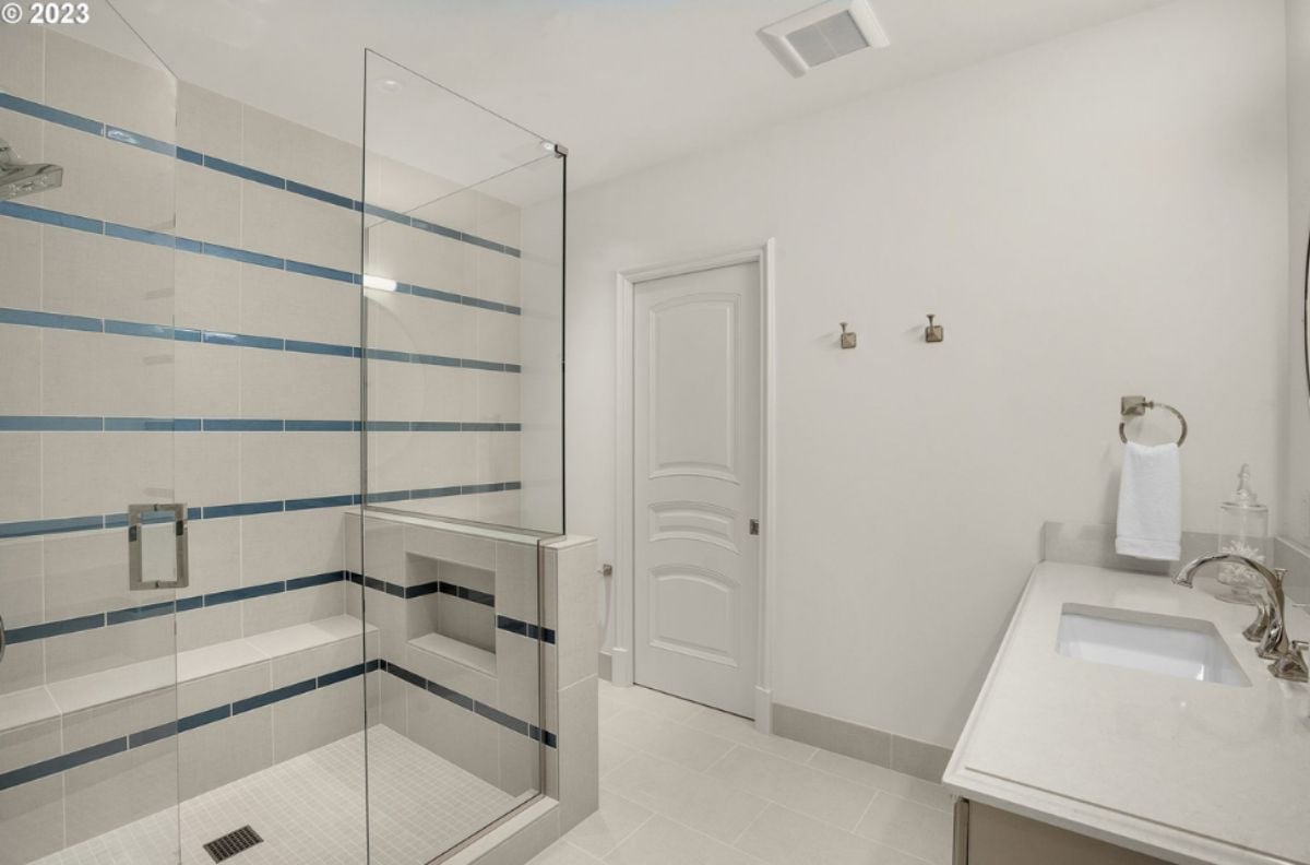Bathroom with a sink and walk-in shower.