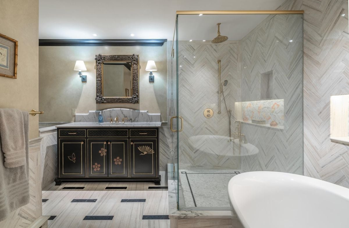 Bathroom with sink, mirror, soaking tub and walk-in shower.