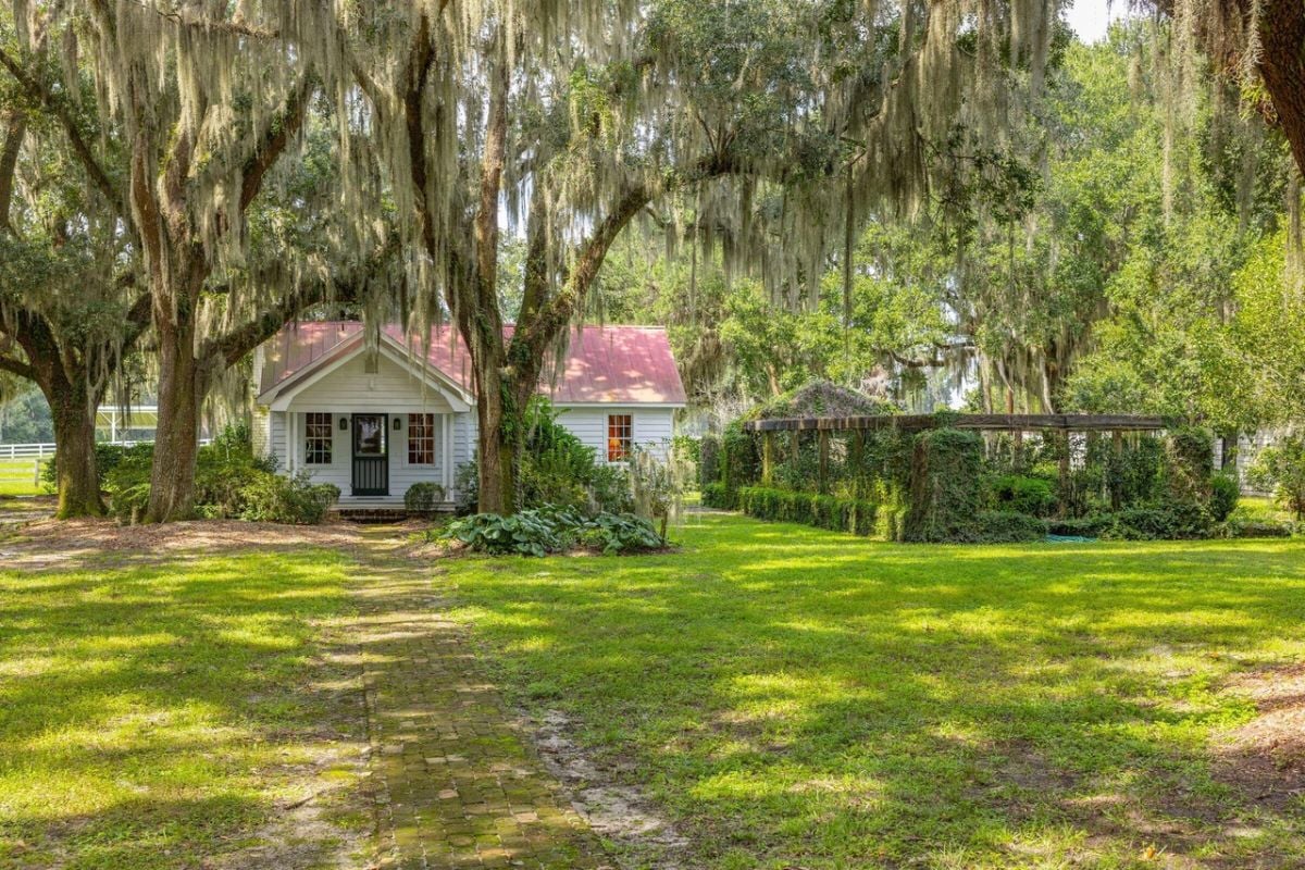 Guest house with a large green lawn.