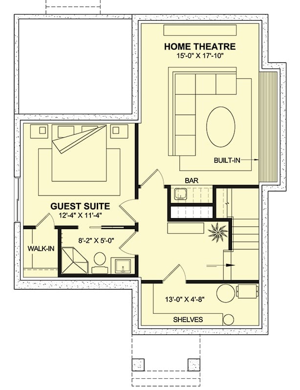 Lower level floor plan with a guest suite and a home theater with a wet bar.