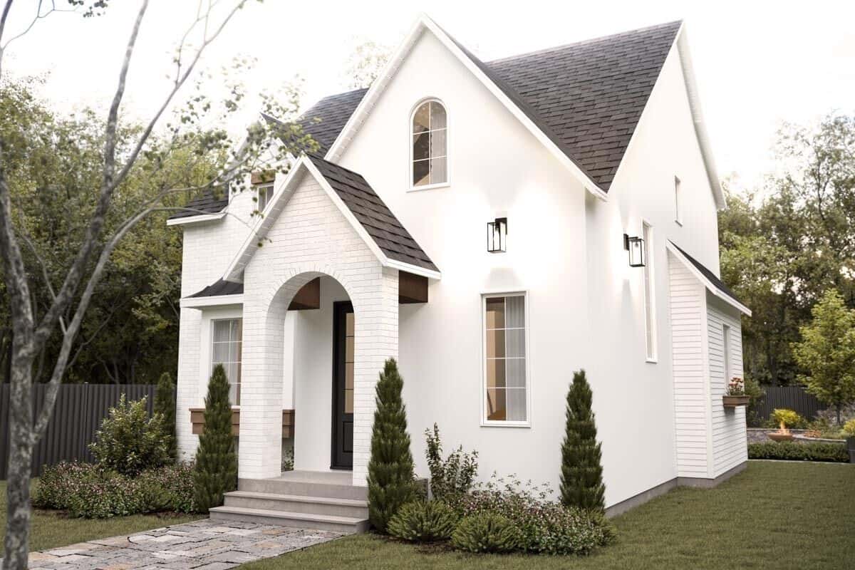 Front view of the house with multiple gables and an arched entry.