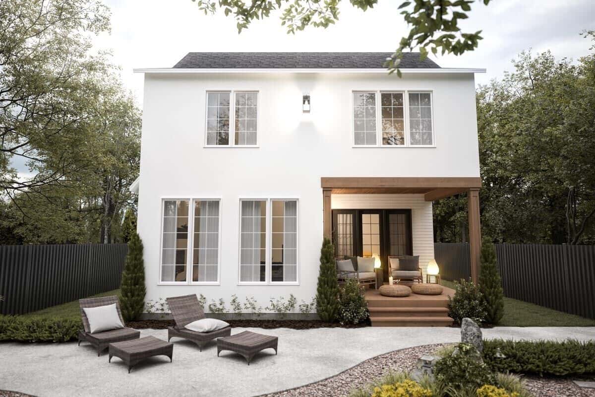 Rear view of the house showcasing the covered patio and white-framed windows.