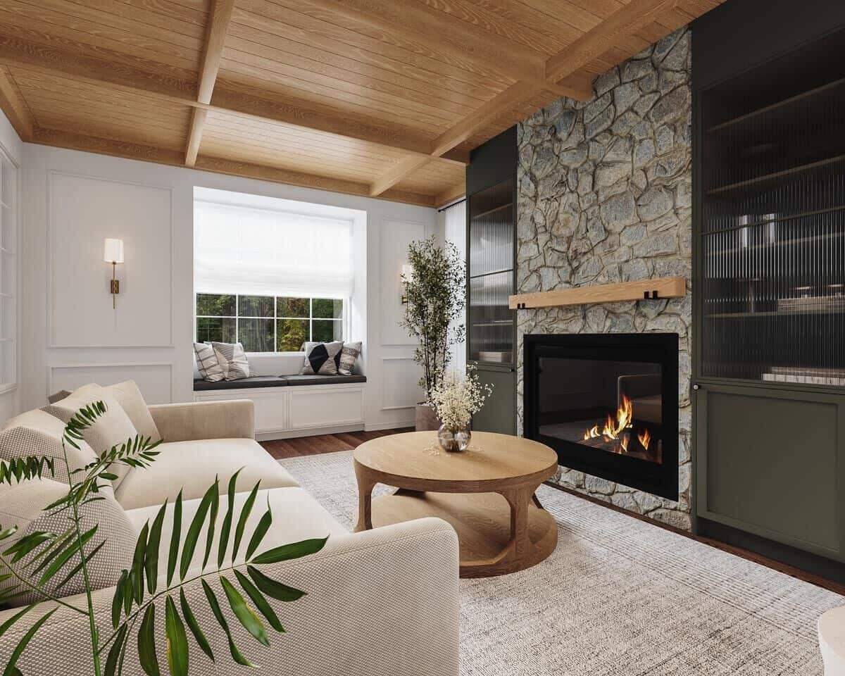 Living room with a sectional sofa, a round coffee table, and a stone fireplace flanked by built-in cabinets.