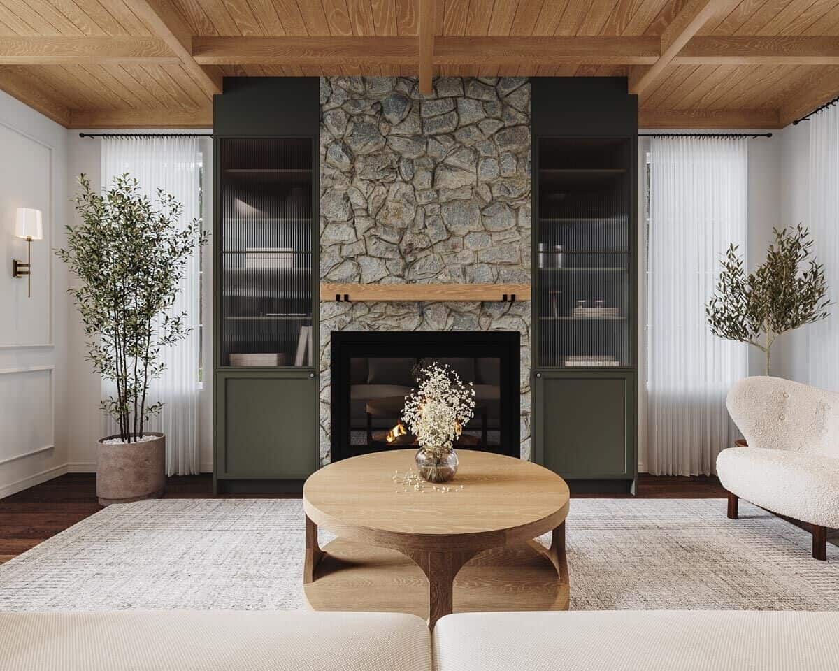 Living room showcasing the stone fireplace under a beamed ceiling.