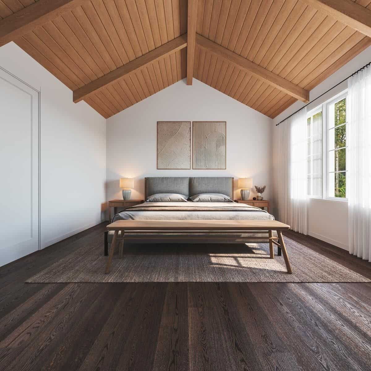 A cathedral ceiling clad in wood planks crowns the primary bedroom.